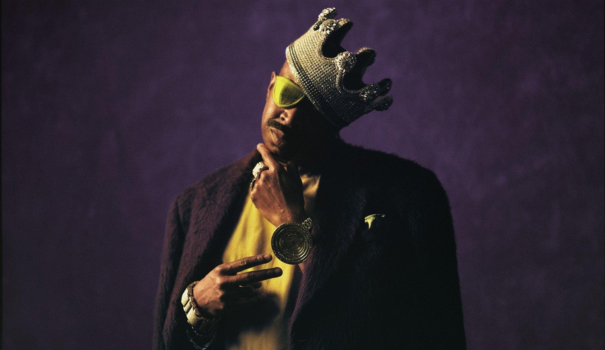 Rapper Slick Rick in a crown and an eye patch